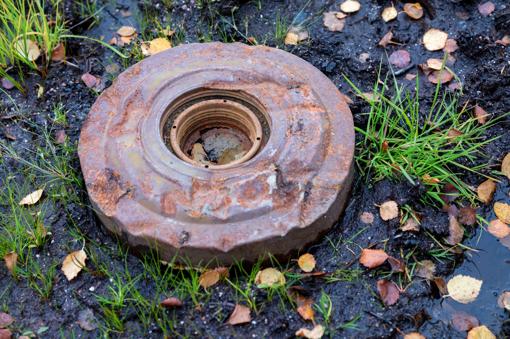 An old anti-personnel mine on the ground